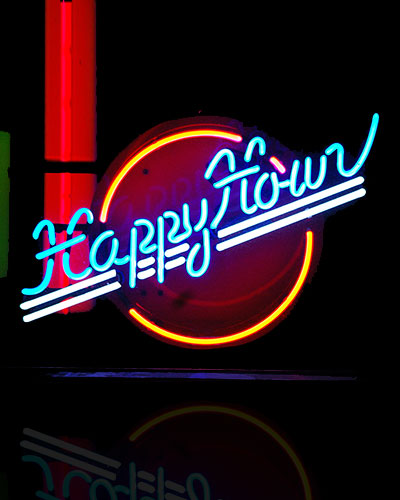 Neon sign shining at night for a tattoo shop